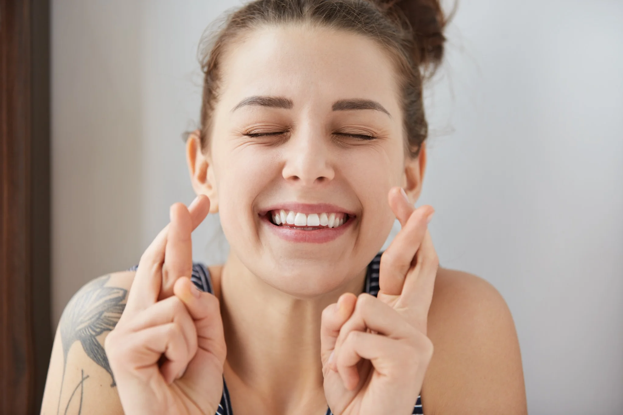 Happy woman showing fresh, clean smile after dental cleaning