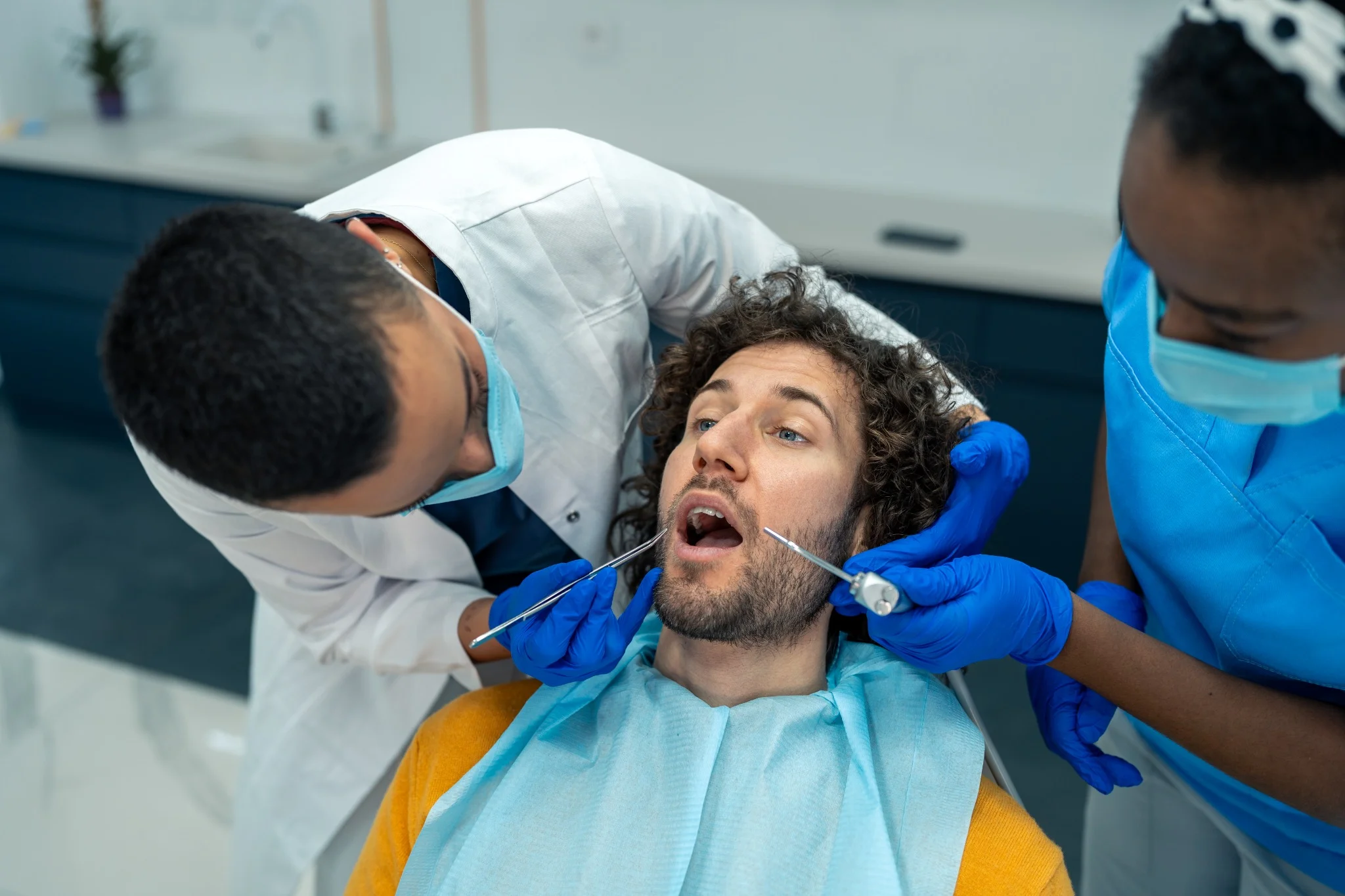 Happy adult patient smiling after successful dental treatment