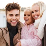 Beautiful family smiling confidently showing healthy smiles